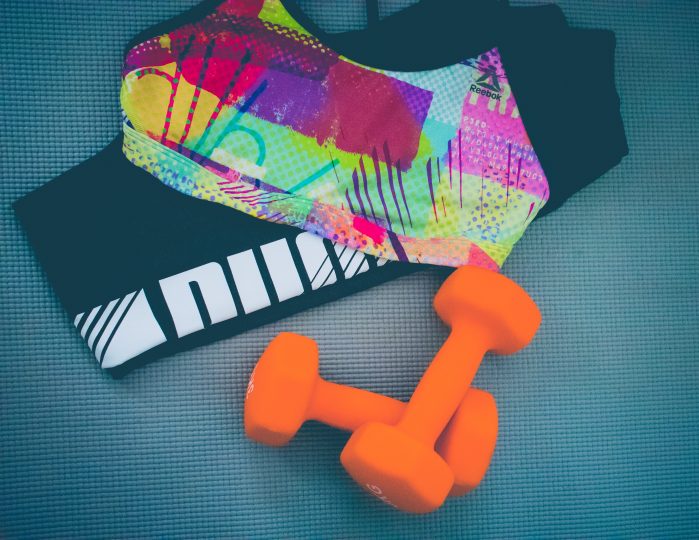 healthy habits for the single woman to cultivate - exercise gear and dumbbells 