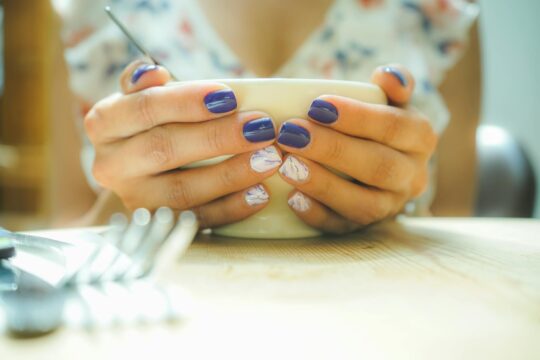 person holding white ceramic bowl