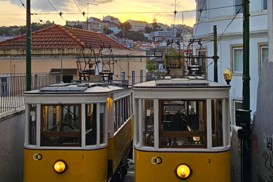 Funiculars in Lisbon sun setting