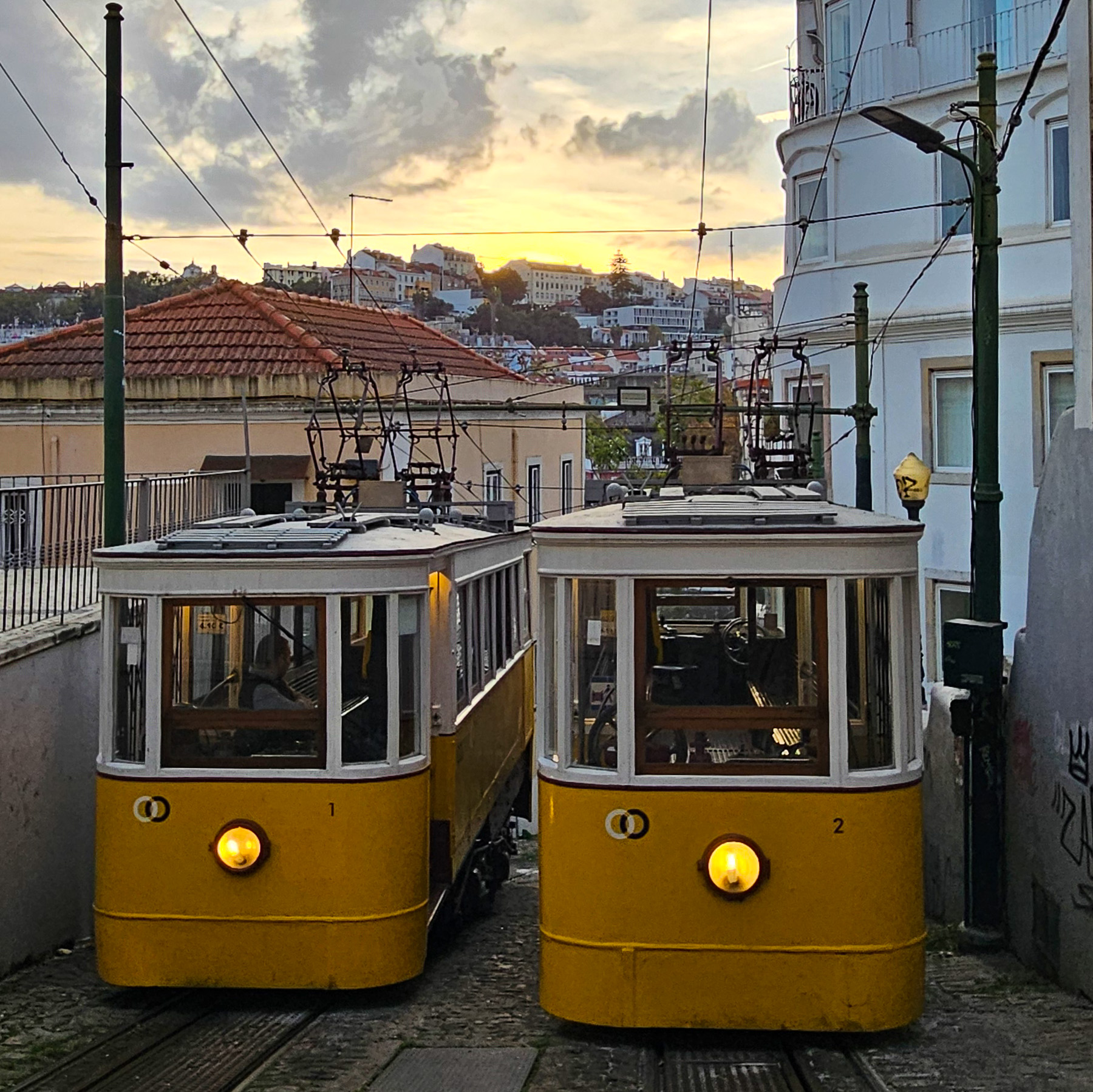 Funiculars in Lisbon sun setting